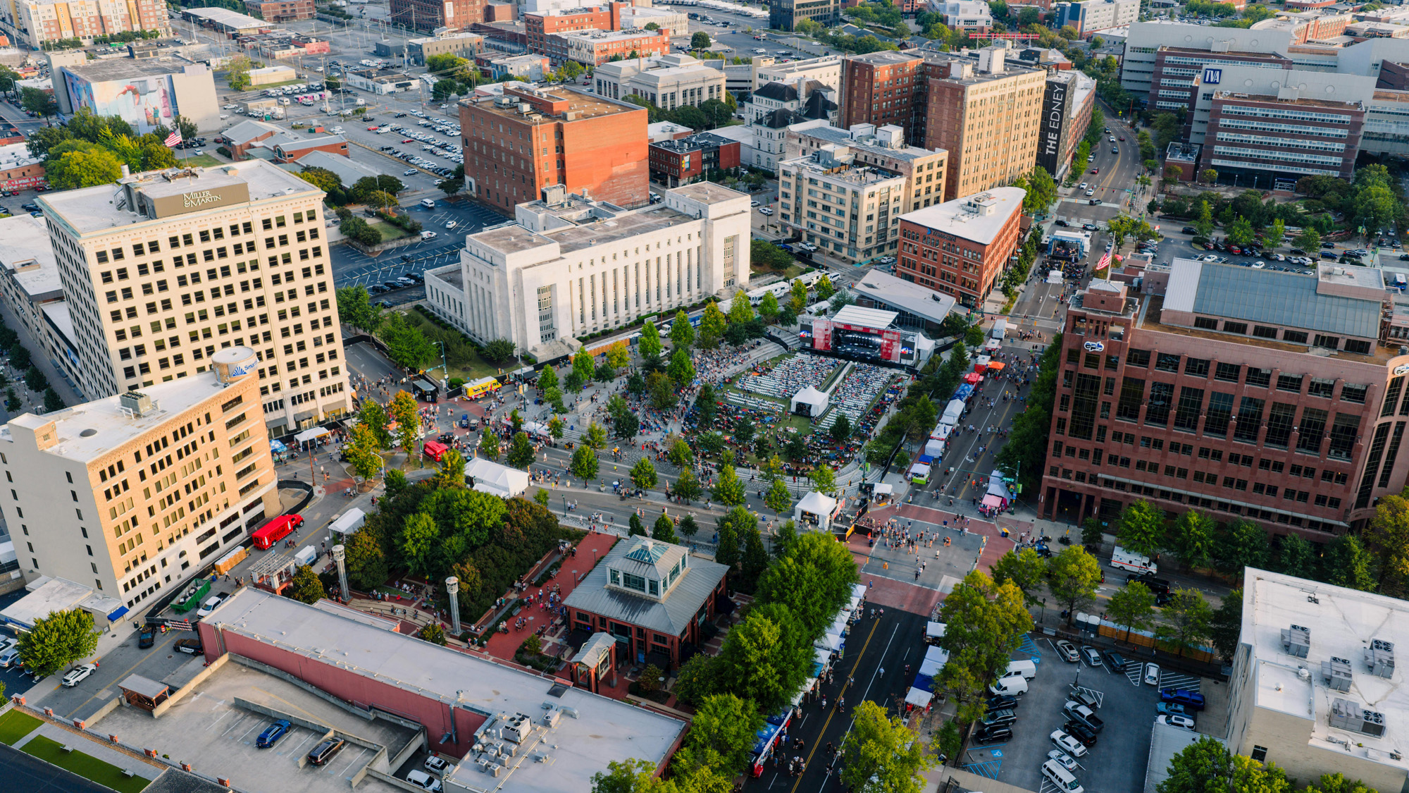 Street scene in downtown Asheville with historic buildings, shops, and people walking