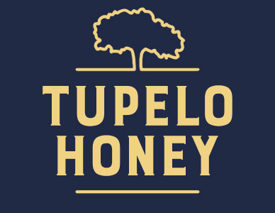 Tupelo Honey restaurant interior with guests dining and warm lighting